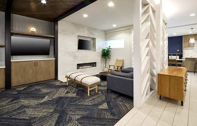 A living room with a grey couch and a wooden coffee table.