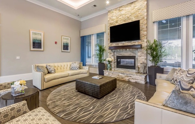 Clubroom With Fireplace And TV at The Oasis at Highwoods Preserve, Tampa, FL