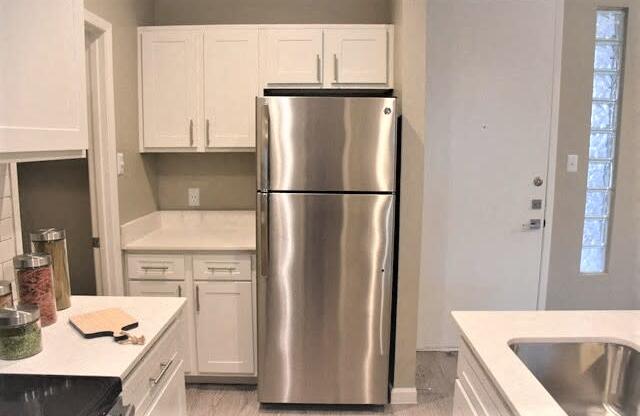 Soho Apartments kitchen area with refrigerator