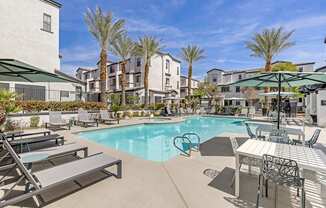 Dive into luxury living at Michael B Apartments, where every day feels like a vacation with our resort-style pool and inviting lounge area.at The Michael B Townhomes and Flats, Nevada