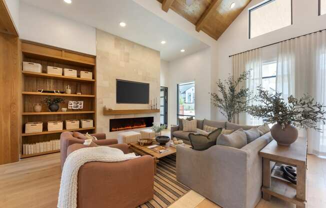 a living room with a fireplace and couches