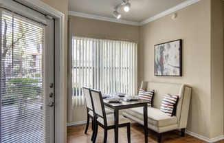 a dining room with a table and chairs