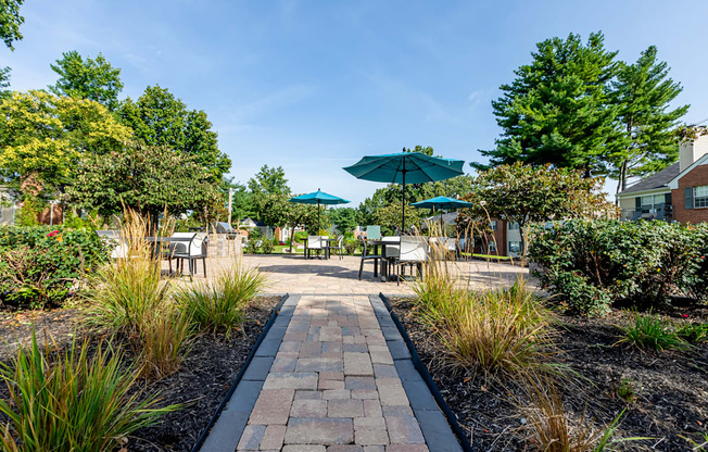 walkway leading to a patio with outdoor dining at Littlestone Apartments