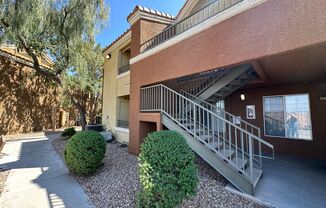 Two bedroom two bathroom upstairs condo in Green Valley Henderson Area with Strip Views off balcony!