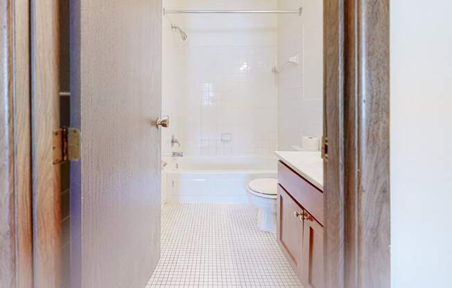 a bathroom with a toilet sink and bathtub