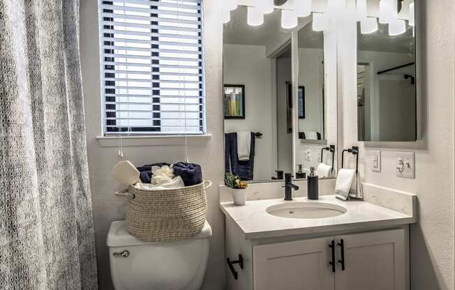 Bathroom With Vanity Lights at Reedhouse Apartments, Boise, ID, 83706
