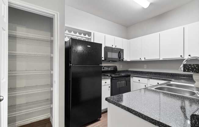 the preserve at ballantyne commons apartment kitchen with black refrigerator