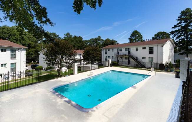 the swimming pool at 1861 muleshoe road with apartment buildings in the background