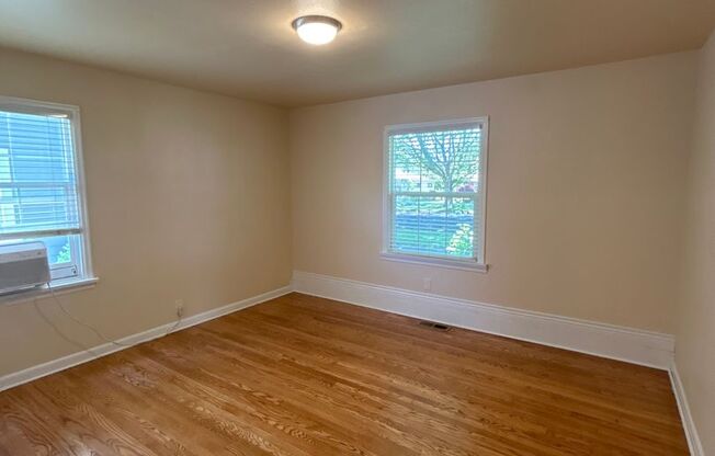 Model three bedroom home, with well-maintained yard & attached garage!