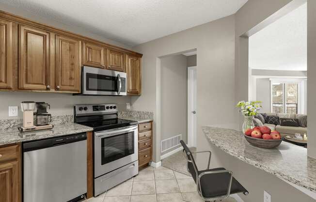 Kitchen with appliances at The Riverwood, Lilydale, MN