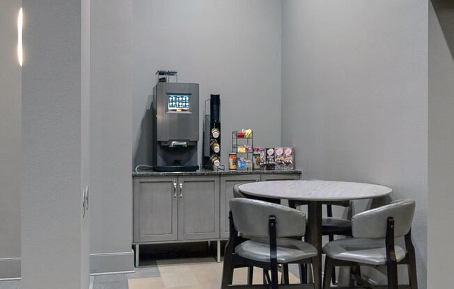 Grab a complimentary cup of coffee in the comfortable and modern lobby at Midtown Crossing Apartments