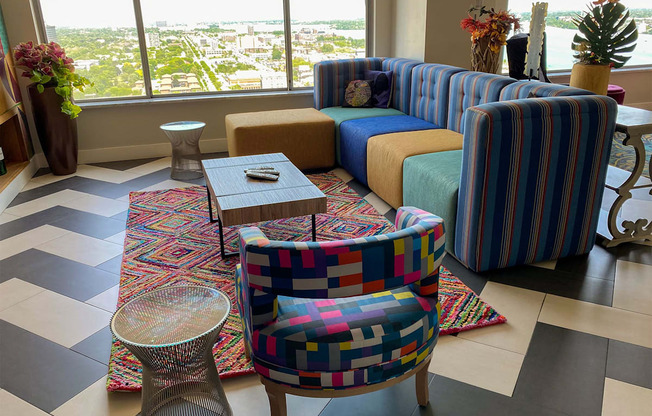 a living room with couches and chairs and a table