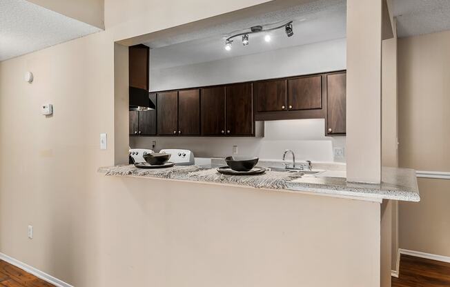 Kitchen With Peek Through Window With Breakfast Bar