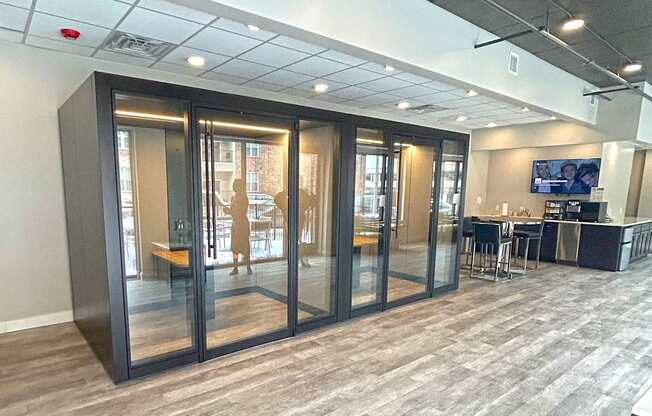 Individual study pods with desks and glass doors