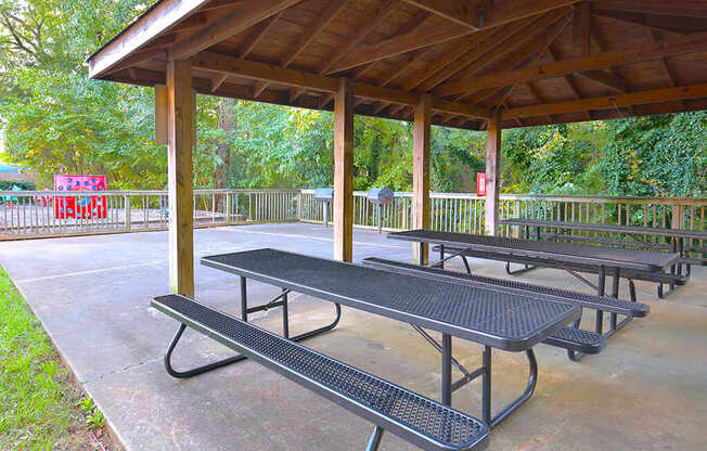 a picnic area with benches and a pavilion