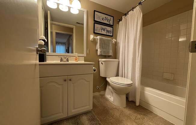 a bathroom with a toilet sink and bathtub