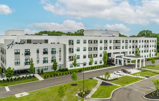 A large white building with the Altura Sign