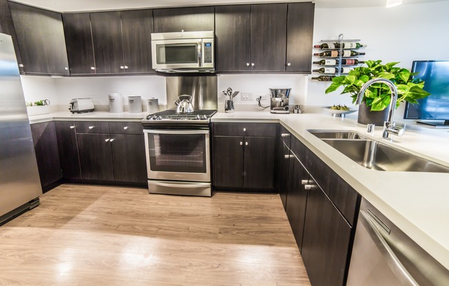 High-end stainless steel appliances and custom cabinets highlight our kitchens
