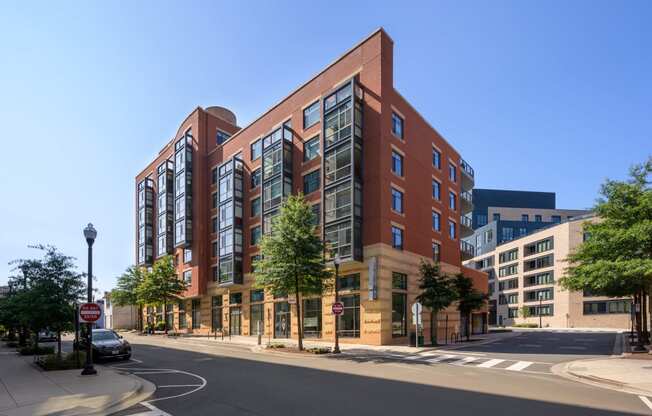 a large brick building on the corner of a city street