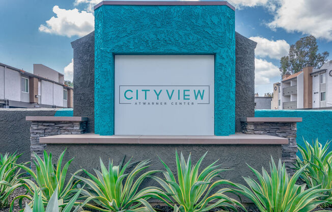 a rendering of the city view experience center with a sign on the front at City View Apartments at Warner Center, Woodland Hills California
