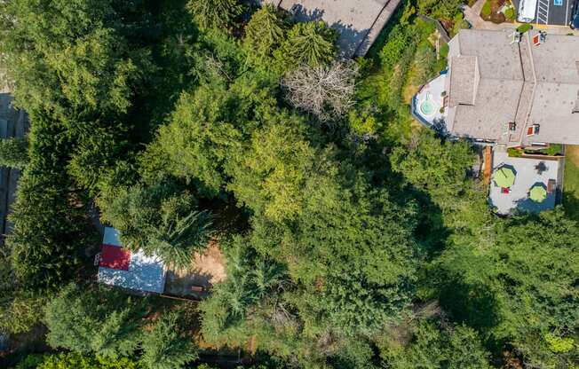 a birds eye view of a house with trees and a pool at Quartz Creek, Mountlake Terrace, WA, 98043