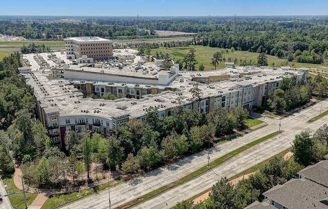 an aerial view of a city with buildings and trees