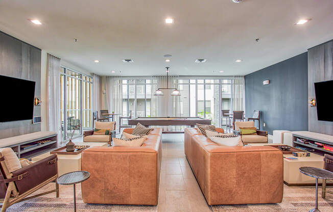 a living room with couches and chairs and a television at Presidium Revelstoke, Fort Worth, Texas