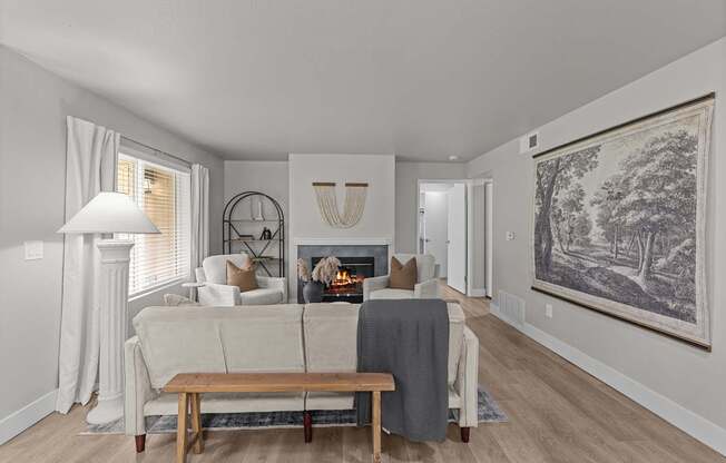 a living room with a couch and a fireplace