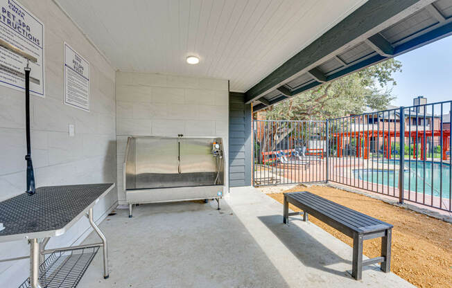 the retreat at thousand oaks apartment patio with swing bench and pool