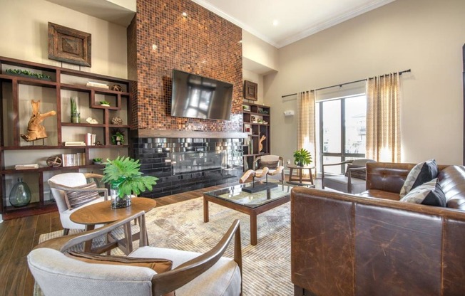 a living room with a fireplace and a tv on the wall