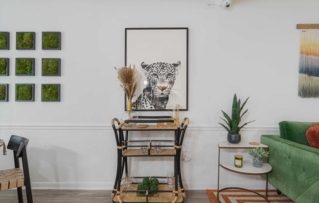 a home office with a desk and a leopard on the wall