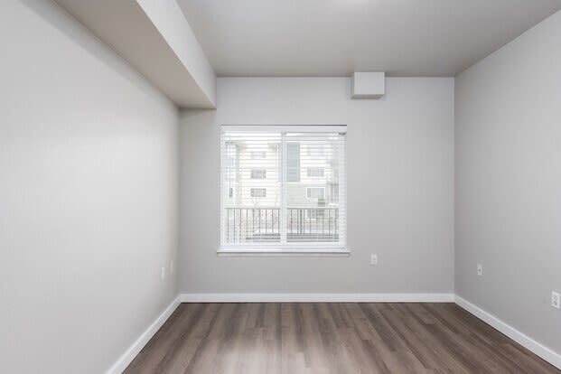 an empty room with a large window