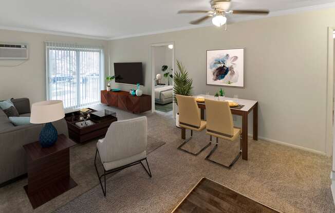 This is a photo of the digitally staged living room of a 742 square foot, 2 bedroom apartment at Romaine Court Apartments in the Oakley neighborhood of Cincinnati, Ohio.