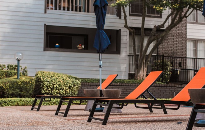 a table and chairs with an umbrella on a patio