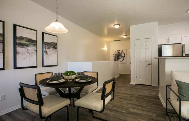 a dining room with a table and chairs