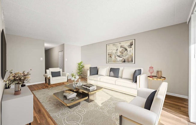 A living room with a white sofa, a coffee table, and a painting on the wall.