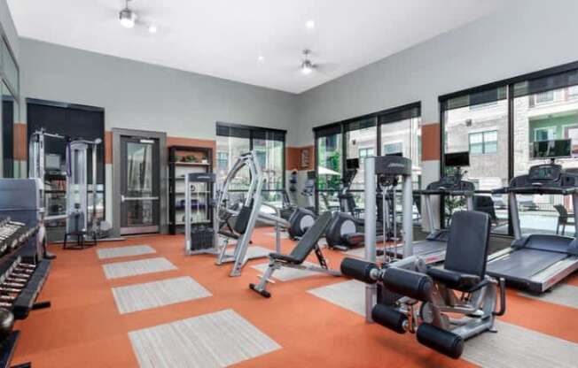 A well-equipped gym with a variety of machines and weightlifting equipment.