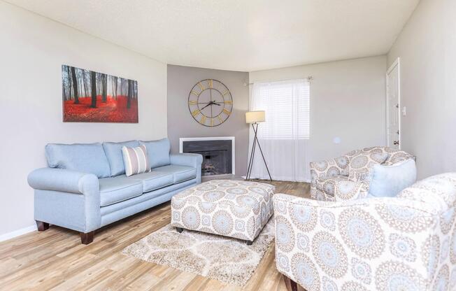 a living room filled with furniture and a fireplace