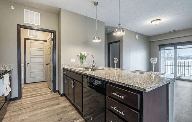 Kitchen with granite counters and island at North Pointe Villas
