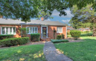 Charming one-level brick end unit condo in the heart of Myers Park!