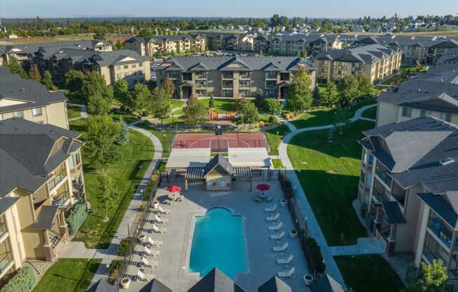 an aerial view of the outdoor pool at the estates at spring creek apartments