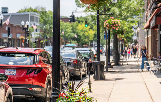 a city street with cars parked on the side of the road