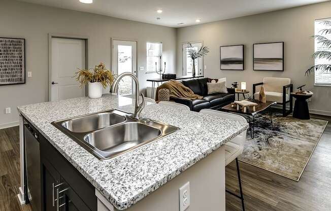 Two and three bedroom townhomes featuring golf course views, fill-size washer and dryer, stainless steel appliances, granite countertops, kitchen island, faux wood flooring and smart-home technology with keyless entry at Sandstone Villas in Omaha, NE