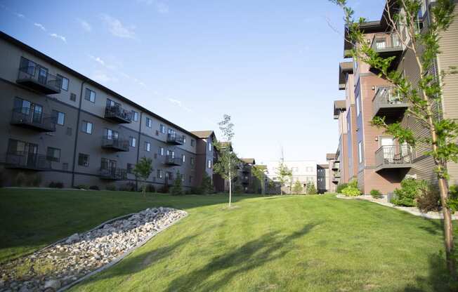 Exterior River Ridge Balconies and Green Lawn