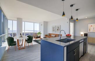 3thirty3 new rochelle ny apartment high rise photo of kitchen and living room with large windows and modern furnishings