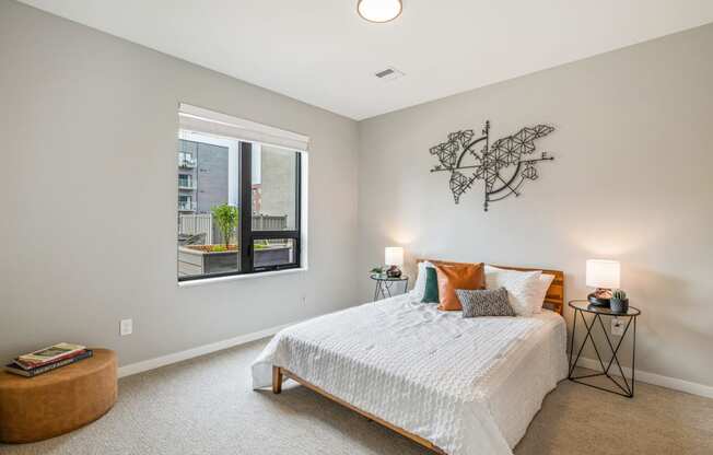 a bedroom with a bed and a large window at EagleRidge Plaza Residences, Fargo, 58104