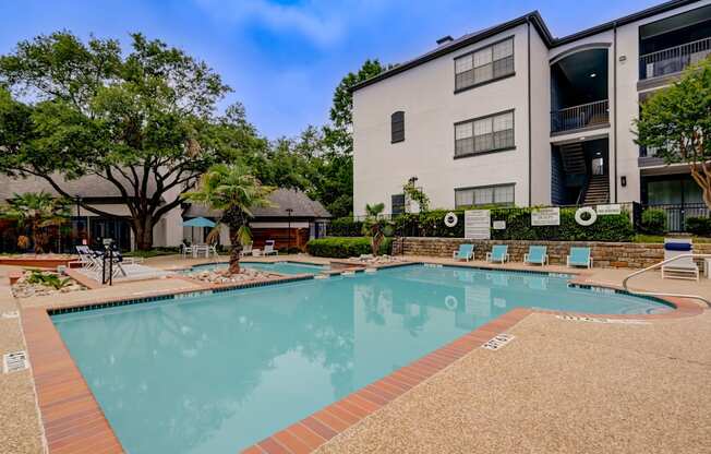 the preserve at ballantyne commons pool and building with trees and buildings