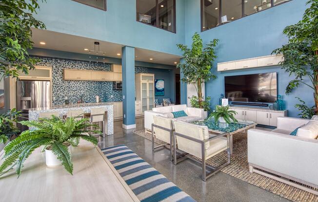 Colorful lounge with patterned tile, tall ceilings, and seating arranged for easy gatherings in our clubroom.
