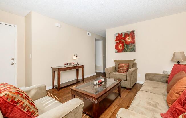 a living room filled with furniture and a flat screen tv