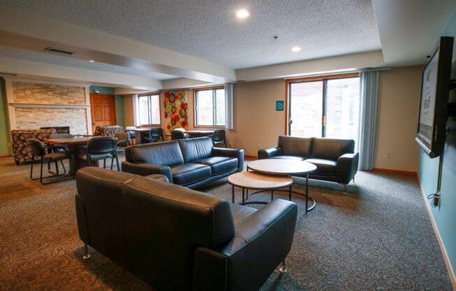 a living room filled with furniture and a flat screen tv